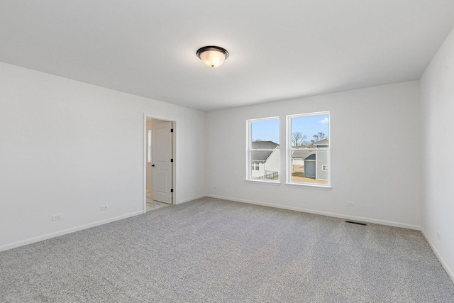32013 Savannah Dr, Lakemoor, IL 60051 - unfurnished room featuring baseboards, visible vents, and light carpet