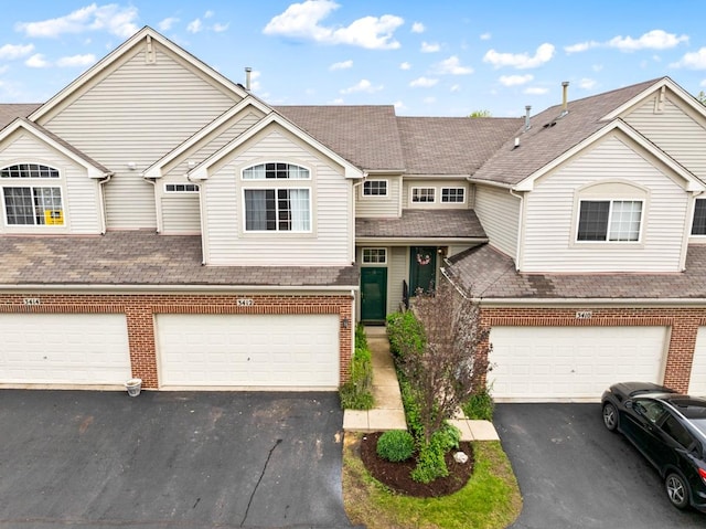 3412 Blue Ridge Dr, Carpentersville, IL 60110 - multi unit property with brick siding, asphalt driveway, an attached garage, and a shingled roof