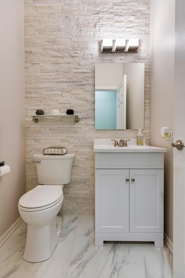 3412 Blue Ridge Dr, Carpentersville, IL 60110 - half bathroom featuring marble look tile flooring, vanity, toilet, and baseboards