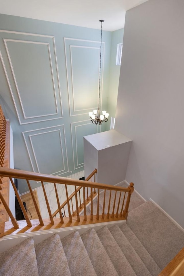 3412 Blue Ridge Dr, Carpentersville, IL 60110 - stairway featuring baseboards, a chandelier, and carpet floors