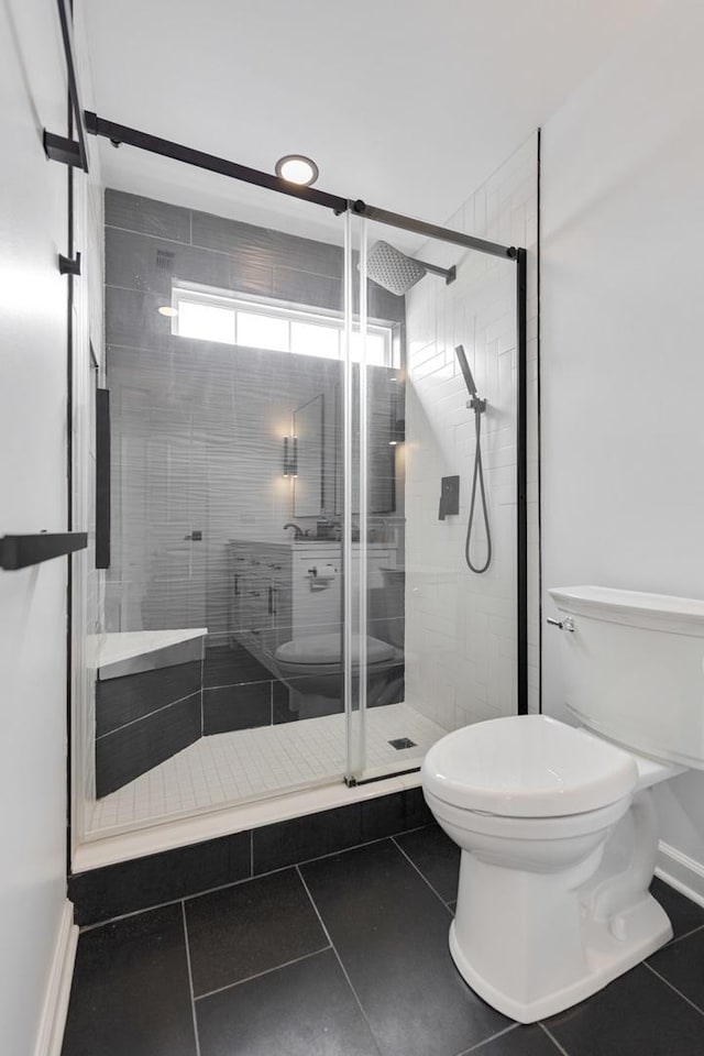 3412 Blue Ridge Dr, Carpentersville, IL 60110 - bathroom with toilet, tile patterned floors, a stall shower, and baseboards