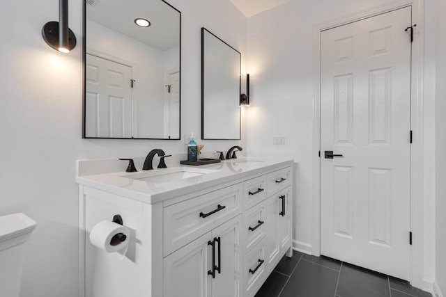 3412 Blue Ridge Dr, Carpentersville, IL 60110 - bathroom featuring double vanity, toilet, tile patterned flooring, and baseboards