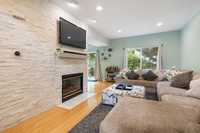 3412 Blue Ridge Dr, Carpentersville, IL 60110 - living area with a stone fireplace, wood finished floors, and recessed lighting