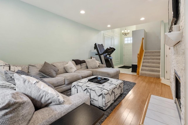 3412 Blue Ridge Dr, Carpentersville, IL 60110 - living room featuring a chandelier, stairs, light wood-type flooring, and recessed lighting