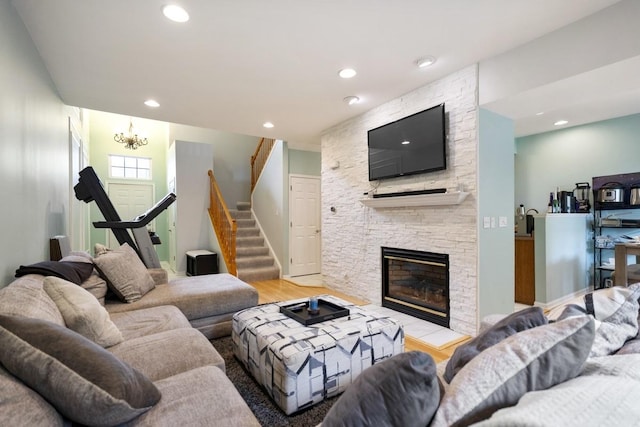3412 Blue Ridge Dr, Carpentersville, IL 60110 - living area with light wood-type flooring, stairway, a stone fireplace, a chandelier, and recessed lighting