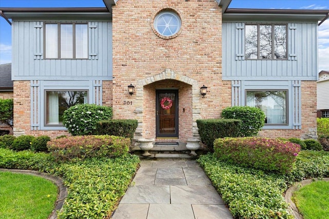 301 Hambletonian Dr, Oak Brook, IL 60523 - view of front facade with board and batten siding and brick siding