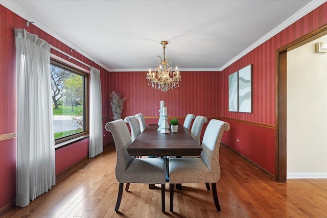 301 Hambletonian Dr, Oak Brook, IL 60523 - dining space featuring light wood-style flooring, crown molding, baseboards, a chandelier, and wallpapered walls