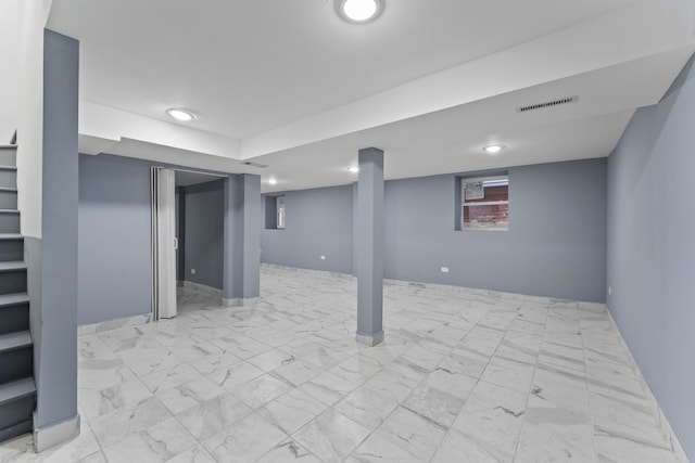 5052 W Huron St, Chicago, IL 60644 - finished basement with visible vents, stairs, baseboards, marble finish floor, and recessed lighting