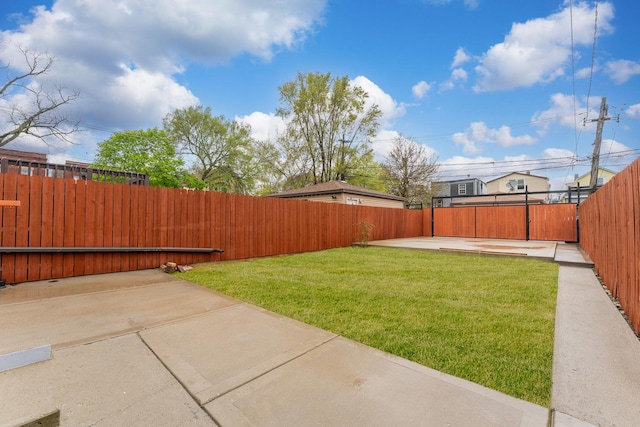 5052 W Huron St, Chicago, IL 60644 - view of yard featuring a patio and a fenced backyard