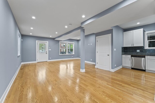 5052 W Huron St, Chicago, IL 60644 - unfurnished living room featuring recessed lighting, baseboards, and light wood-style floors