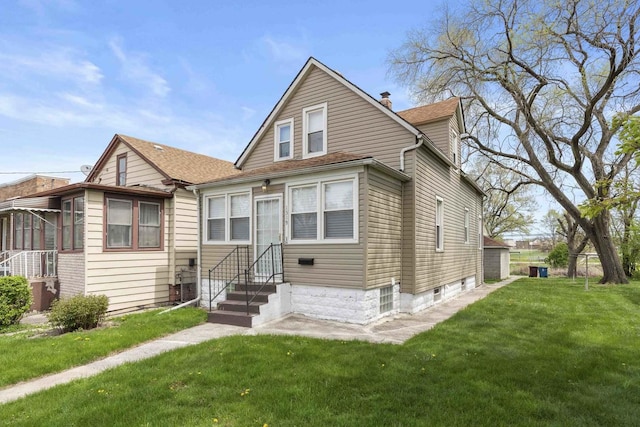 1319 Washington St, Chicago Heights, IL 60411 - bungalow-style house featuring a front yard, a chimney, and entry steps