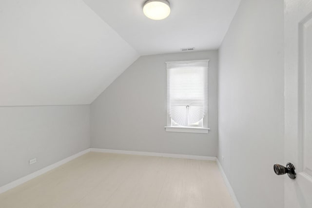 1319 Washington St, Chicago Heights, IL 60411 - additional living space featuring baseboards, visible vents, and lofted ceiling