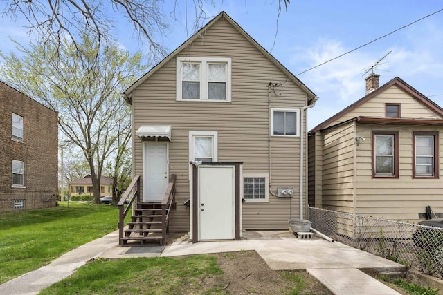 1319 Washington St, Chicago Heights, IL 60411 - rear view of house featuring fence and a yard