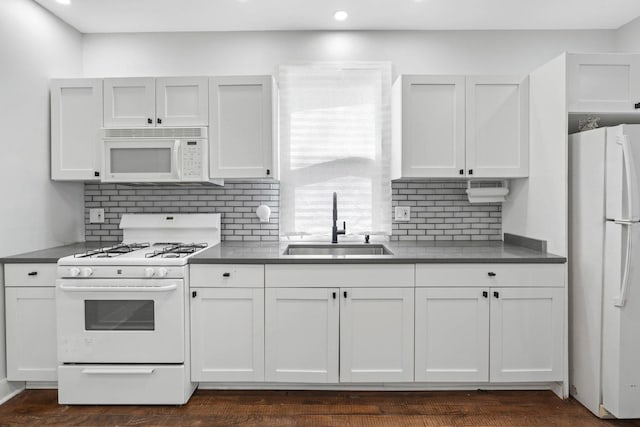 1319 Washington St, Chicago Heights, IL 60411 - kitchen with a sink, white cabinetry, dark countertops, and white appliances