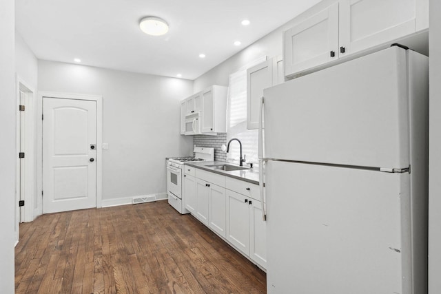 1319 Washington St, Chicago Heights, IL 60411 - kitchen with visible vents, a sink, white cabinets, white appliances, and dark wood-type flooring