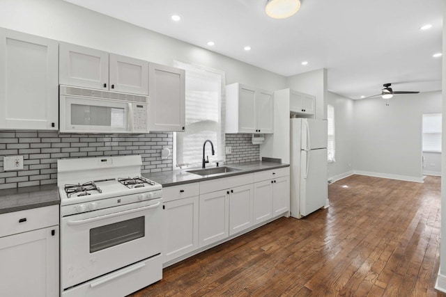 1319 Washington St, Chicago Heights, IL 60411 - kitchen with a sink, dark countertops, a ceiling fan, and white appliances