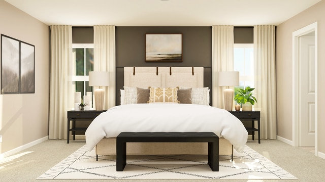 bedroom with baseboards and light colored carpet