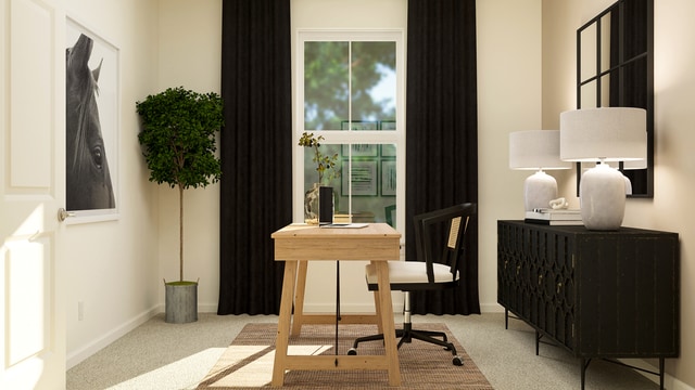 carpeted office featuring baseboards