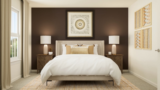 carpeted bedroom with baseboards