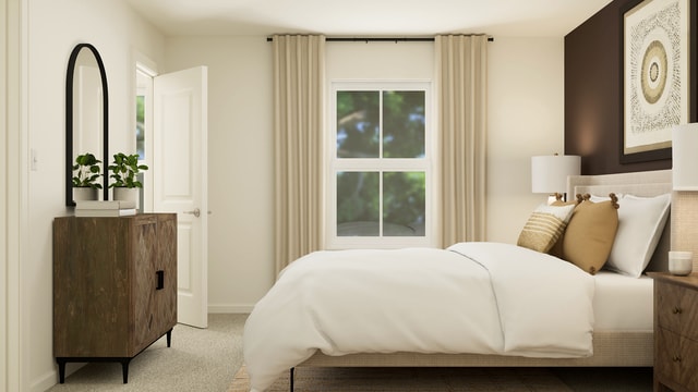 bedroom with baseboards and carpet floors