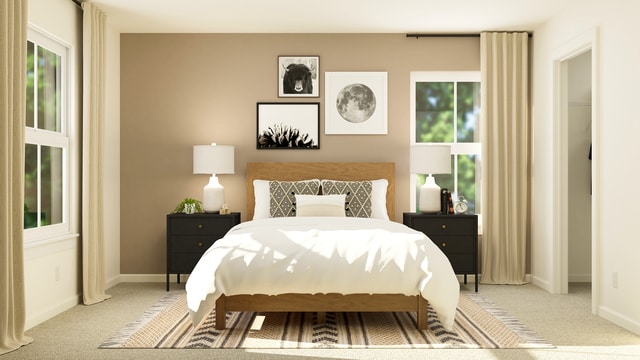 bedroom with baseboards and light carpet
