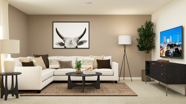 living area with carpet floors and baseboards