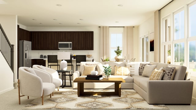 living area with stairway and light carpet