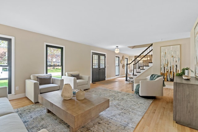 16 S Northampton Dr, Geneva, IL 60134 - living room featuring stairway, a wealth of natural light, and light wood-style floors