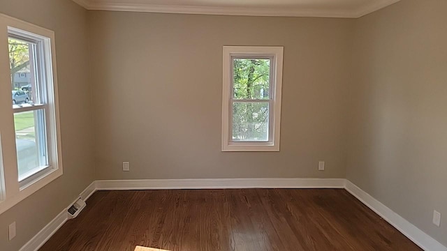 226 N Wilmette Ave, Westmont, IL 60559 - spare room featuring a healthy amount of sunlight, dark wood finished floors, and visible vents