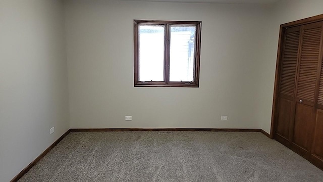 226 N Wilmette Ave, Westmont, IL 60559 - unfurnished bedroom featuring carpet flooring, baseboards, visible vents, and a closet