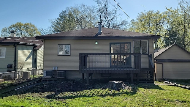 226 N Wilmette Ave, Westmont, IL 60559 - back of house featuring central AC, fence, a deck, a shingled roof, and a lawn