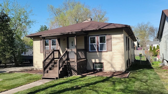 226 N Wilmette Ave, Westmont, IL 60559 - view of front of property with fence, a chimney, and a front yard
