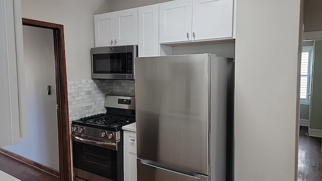 226 N Wilmette Ave, Westmont, IL 60559 - kitchen featuring white cabinets, stainless steel appliances, decorative backsplash, and wood finished floors