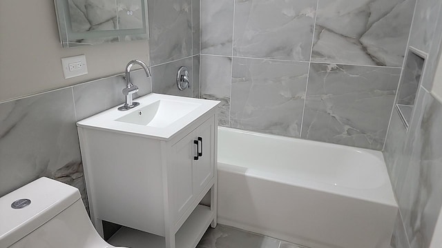 226 N Wilmette Ave, Westmont, IL 60559 - full bathroom featuring toilet, tile walls, marble finish floor, and vanity