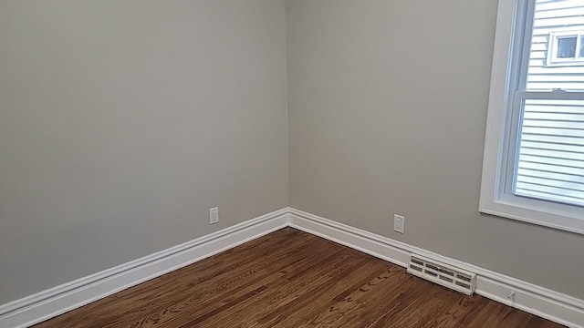 226 N Wilmette Ave, Westmont, IL 60559 - unfurnished room featuring baseboards, plenty of natural light, dark wood-style flooring, and visible vents