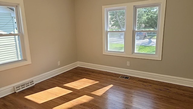 226 N Wilmette Ave, Westmont, IL 60559 - empty room with baseboards, dark wood-style floors, and visible vents