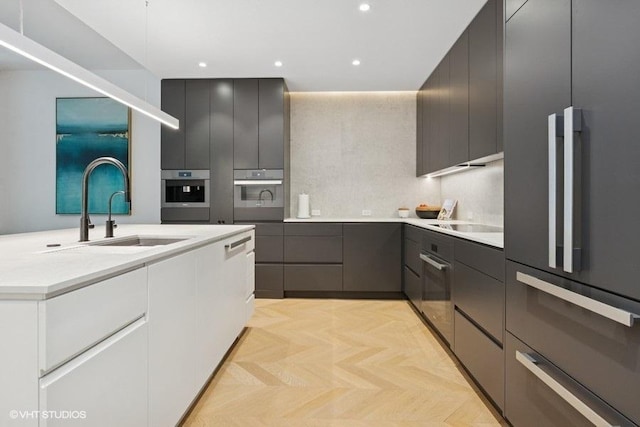 1917 S Calumet Ave, Chicago, IL 60616 - kitchen with appliances with stainless steel finishes, a sink, modern cabinets, light countertops, and recessed lighting