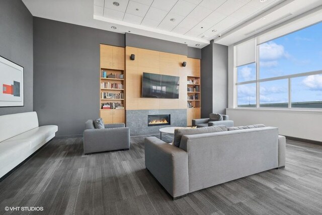 1917 S Calumet Ave, Chicago, IL 60616 - living room with built in features, a fireplace, baseboards, and a raised ceiling