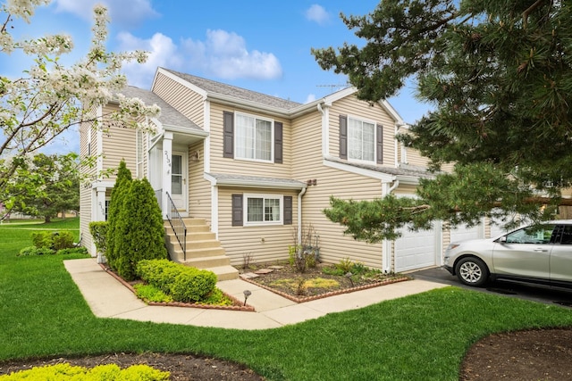view of side of home featuring driveway, a garage, and a lawn