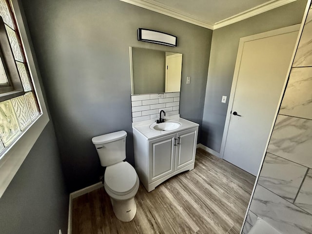 106 Kazwell St, Willow Springs, IL 60480 - bathroom with toilet, vanity, wood finished floors, ornamental molding, and tasteful backsplash