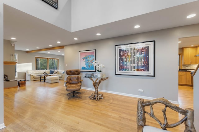 sitting room with recessed lighting, light wood-style flooring, and baseboards