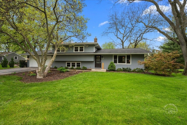 10S173 Ridge Rd, Naperville, IL 60565 - split level home featuring a chimney, a front yard, and aphalt driveway