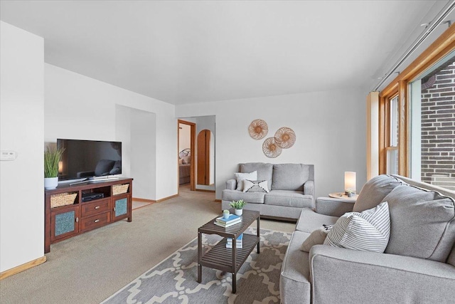 5532 W Lawrence Ave Unit 2S, Chicago, IL 60630 - living room with carpet flooring, baseboards, and arched walkways