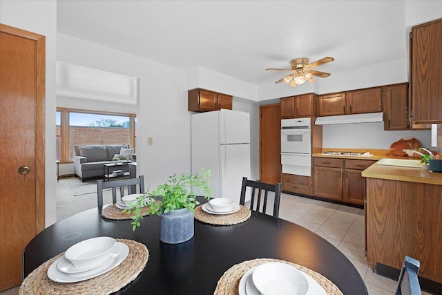 5532 W Lawrence Ave Unit 2S, Chicago, IL 60630 - dining area with a ceiling fan and light tile patterned flooring