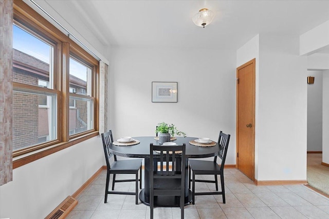 5532 W Lawrence Ave Unit 2S, Chicago, IL 60630 - dining room with baseboards and light tile patterned floors
