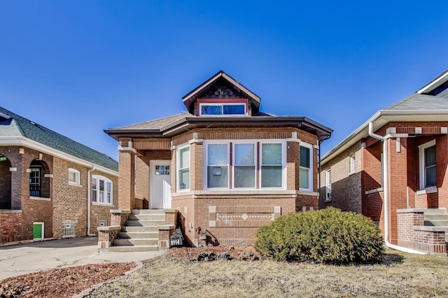 bungalow with brick siding