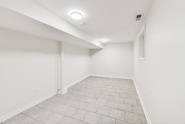 finished below grade area with baseboards and visible vents