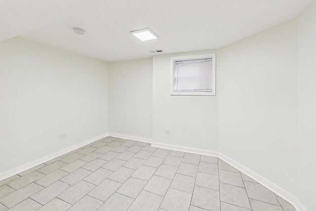 unfurnished room with visible vents, baseboards, and light tile patterned floors