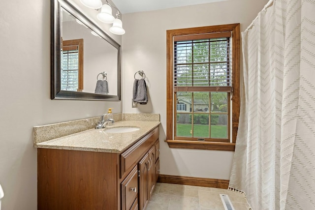 carpeted bedroom with baseboards and ceiling fan