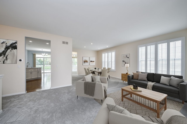 1834 Highbury Ln, Aurora, IL 60502 - living room featuring carpet flooring, plenty of natural light, a chandelier, and recessed lighting